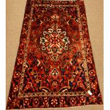 Persian Bakhtiar red ground rug, 237cm x 143cm Condition Report <a href='//www.