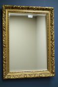 Small bevelled edge wall mirror in floral gilt frame,