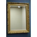 Small bevelled edge wall mirror in floral gilt frame,