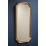 Canted gilt framed mirror with bevelled glass,