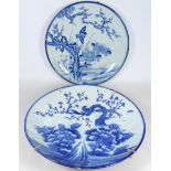 Two large Japanese Arita porcelain chargers decorated with a swallow and cherry blossom and an