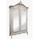 Late 19th century painted French armoire, carved detail, shaped bevelled mirror glazed doors,