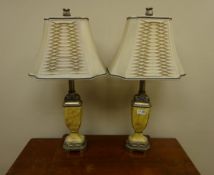 Pair of traditional style table lamps with acanthus leaf finials,