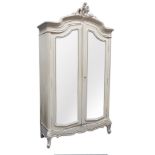 Late 19th century French white painted armoire, shaped top with carved pediment,