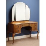 Early 20th century kidney shaped walnut dressing table with triple mirror, four drawers,