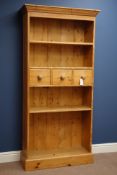 Traditional pine four tier book case with three centre drawers, W85cm, H176cm,