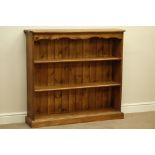 Waxed pine three tier bookcase (W114cm, H105cm, D28cm),