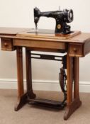 20th century walnut cased Singer treadle sewing machine, W88cm, H77cm,