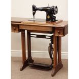 20th century walnut cased Singer treadle sewing machine, W88cm, H77cm,