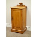 Edwardian walnut bedside cabinet, carved raised back,