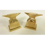 Two bronze anvil paperweights with stands,