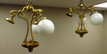 Pair of Art Nouveau brass light fittings with five globular glass shades,
