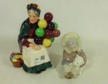 Royal Doulton 'The Balloon Seller' and a Lladro figure of an Eskimo with a Polar Bear (2)