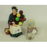 Royal Doulton 'The Balloon Seller' and a Lladro figure of an Eskimo with a Polar Bear (2)