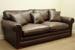 Large three seater sofa upholstered in brown 'Derwent' leather, with scatter cushions,