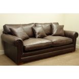 Large three seater sofa upholstered in brown 'Derwent' leather, with scatter cushions,