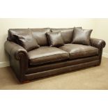 Large three seater sofa upholstered in brown 'Derwent' leather, with scatter cushions,