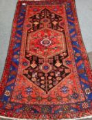 Persian Hamadan red ground rug, pole medallion,