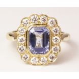 Sapphire and diamond cluster gold ring hallmarked 18ct (sapphire approx 1.