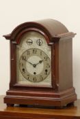Early 20th century mahogany case mantel clock, arched door with bevelled glass,