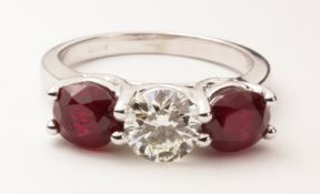 Three stone brilliant cut diamond and ruby white gold ring hallmarked 18ct (diamond approx 1 carat