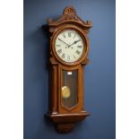 Early 20th century walnut cased regular wall clock, circular dial with Roman numerals,