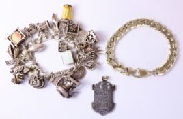 Silver bracelet London 1975 with approx 24 charms,