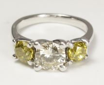 Diamond and yellow diamond three stone white gold ring tested to 18ct (diamond approx 1 carat,