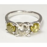 Diamond and yellow diamond three stone white gold ring tested to 18ct (diamond approx 1 carat,