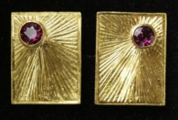 Pair of ruby set gold cuff-links tested to 18ct approx 10.