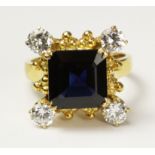 Square set sapphire and four diamond ring tested to 18ct approx 6.