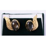 Pair leaf scroll ear-rings set with black star sapphires tested to 18ct Condition Report