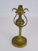 Ships brass table lamp with reeded column and gimbal in scroll supports,