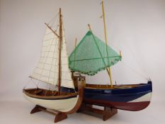 Part wooden model of a Coble type sail fishing boat, L53cm, & a Hanah boats model of a fishing boat,