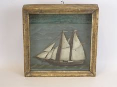 Cased niave diorama of a the French two master 'Harah' under full sail, W29cm, D6cm, H29cm.