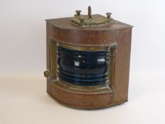 Copper ships lantern with blue glass front,