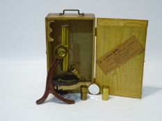 Early 20th century brass monocular microscope with rack & pinion focus, stamped J Lizars,
