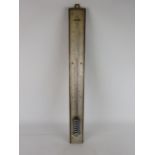 Large late 19th century alcohol thermometer with silvered scale on oak mount, H62cm.