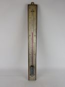Large late 19th century alcohol thermometer with silvered scale on oak mount, H62cm.