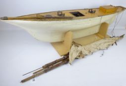 Large early 20th century Pond Yacht on stand, white painted weighted wooden hull with mast, L115cm,