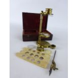 Early 19th century lacquered brass portable botanical microscope with slide stage adjustment and
