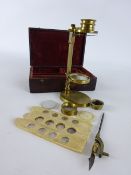 Early 19th century lacquered brass portable botanical microscope with slide stage adjustment and