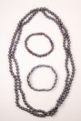 Long grey freshwater pearl necklace and two similar bracelets Condition Report