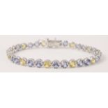 Blue and yellow round sapphire bracelet stamped 750 Condition Report <a