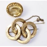 Four circle gold brooch and a gold mounted citrine brooch both tested to 9ct Condition