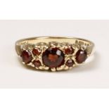 Early 20th century garnet gypsy ring hallmarked 9ct Condition Report <a