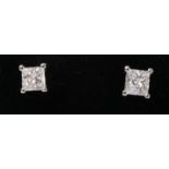 Pair princess cut diamond stud ear-rings stamped 750 approx 0.