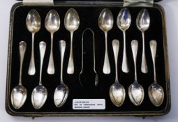 Set of twelve hallmarked silver teaspoons and sugar nips,
