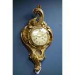 Regency style giltwood wall clock with scrolling pediment,
