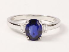 Oval sapphire and baguette diamond white gold ring hallmarked 18ct,